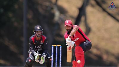 UAE, in black, suffered a 182-run defeat to Hong Kong, in red, when they met at the pool stages of the Asia Cup Qualifier in Malaysia. Courtesy ACC