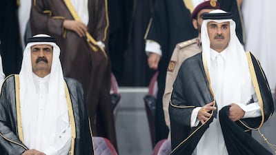 Sheikh Tamim Bin Hamad al-Thani and his father, Sheikh Hamad bin Khalifa Al Thani, at an Arabian Gulf Cup football match in Doha, November 26, 2019. EPA