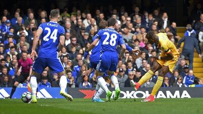 Wilfried Zaha scores Crystal Palace's first goal during the 2-1 win against Chelsea. Hannah McKay / Reuters