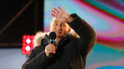 Russian President Vladimir Putin thanks supporters and calls for national unity, at a rally near the Kremlin on March 18, 2018, the day he was re-elected with a landslide victory. Alexander Zemlianichenko / AP Photo