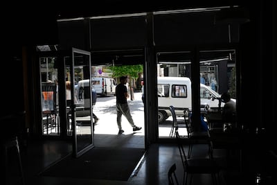 Residents stand outside a restaurant during a massive power cut in Vigo, north-western Spain. AFP