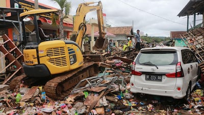 Rescuers look for survivors along the coast in South Lampung. AFP