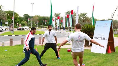 The day began with a power walk around the DIFC grounds then there were classes, including Body Pump and Zumba, football and basketball matches, and children’s activities such as a bouncy castle. Victor Besa for The National