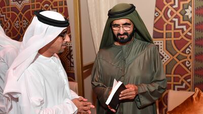Sheikh Mohammed bin Rashid receives a book from Mohammed Al Hammadi, Editor-in-Chief of Aletihad newspaper. Wam