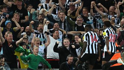Newcastle striker Alexander Isak celebrates scoring in front of the away fans. AFP