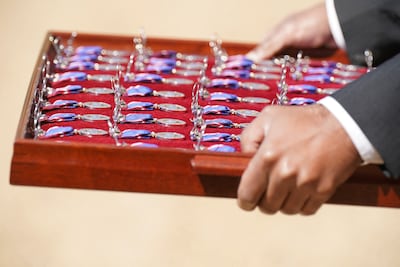 King Charles III personally presented the medals. Reuters