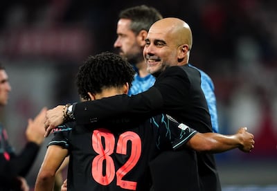 Pep Guardiola with Rico Lewis after Manchester City's win at RB Leipzig. PA