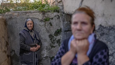 Women stand by the entrance to a basement during shelling in the city of Terter, Azerbaijan. AFP