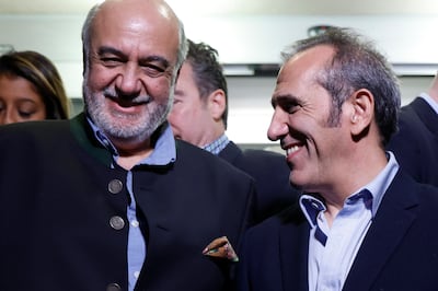 Freed Americans Morad Tahbaz and Emad Shargi smile upon their return to the US. AP