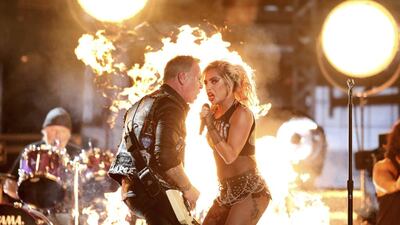 Lady Gaga, right, and James Hetfield of Metallica perform Moth Into Flame at the 59th annual Grammy Awards. Matt Sayles / Invision / AP