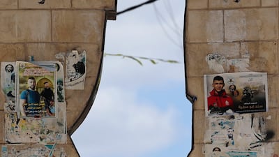 A Palestinian passes a monument depicting Mandatory Palestine in the West Bank town of Jenin. AFP