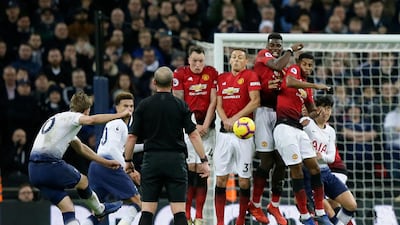 Kane, left, shoots a free kick. AP Photo