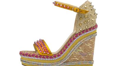 Trust Christian Louboutin to be fearless, covering this wedge in a bold mix of studs, weaving and even metallic cork. Courtesy Christian Louboutin
