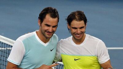 UAE Royals' Roger Federer, left, and Indian Aces' Rafael Nadal pose for pictures after their men's singles match in the International Premier Tennis League (IPTL) in New Delhi, India, December 12, 2015. REUTERS/Anindito Mukherjee