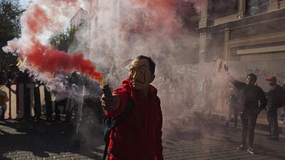 A demonstrator dressed as a character of TV series 'Money Heist' takes part in a march in Mexico City, during the commemoration of the 51th anniversary of the 1968 Tlatelolco student massacre. AFP