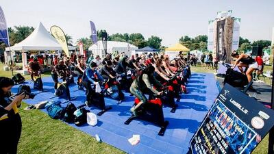 Participants at an RPM group fitness class at Yas Fitness Festival