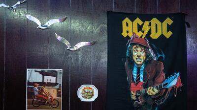 The Flower Shop laid back decor features plenty of rock posters and 1970s imagery.