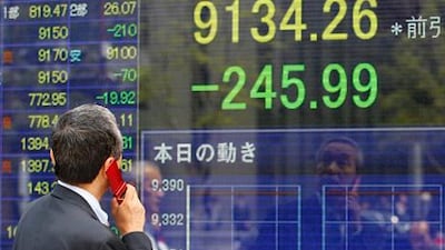 Stock markets in Asia and UAE fall Monday by weekend election results in Greece and France that heightened uncertainty about Europe's ability to solve its debt crisis. (AP Photo/Shizuo Kambayashi)