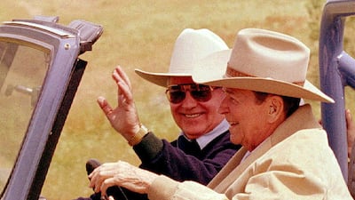 Reagan takes Gorbachev for a drive to tour the ranch. Reuters
