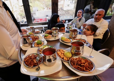 A worker serves Koshary, an Egyptian vegan dish recognised by Unesco as part of its Intangible Cultural Heritage. Reuters