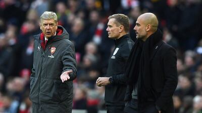 Arsenal manager Arsene Wenger, left, is aghast at questions regarding his job. Neil Hall / EPA