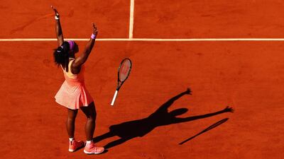 Serena Williams celebrates after winning the match point. Clive Brunskill / Getty Images