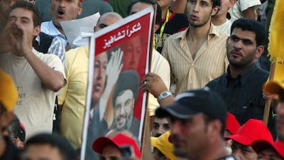 Hezbollah supporters at a 2006 rally in Beirut, with a placard featuring the Lebanese group's former leader Hassan Nasrallah and Venezuela's late president Hugo Chavez. Getty Images