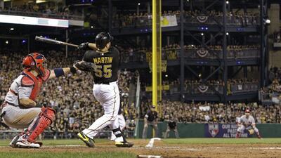 Catcher Russell Martin drove in the go-ahead run in the eighth inning for Pittsburgh on Sunday. Gene J Puskar / AP