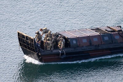 Military personnel arrive at Portland port after the operation onboard the Smyrtos tanker. Getty Images