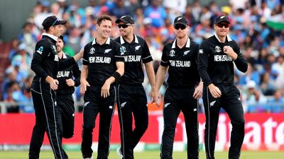 Henry, third left, celebrates with teammates the dismissal of India's Rohit Sharma. AP Photo