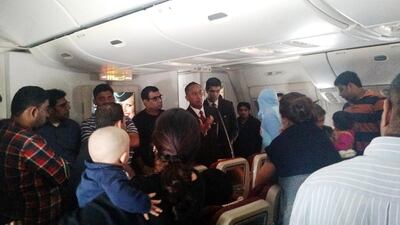 Passengers on EY 183 were told by flight crew the airport was too crowded to let them off the grounded airliner. Rithvik Reddy / AP Photo