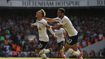 Tottenham Hotspur's Christian Eriksen, left, celebrates scoring his goal with teammate Nacer Chadli on Sunday during their side's Premier League win over Southampton at White Hart Lane in London. Ian Kington / AFP / October 5, 2014