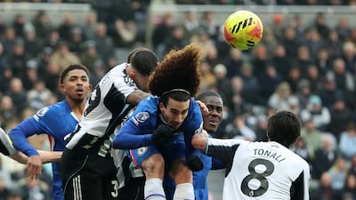 Chelsea's Marc Cucurella heads the ball away from danger. PA
