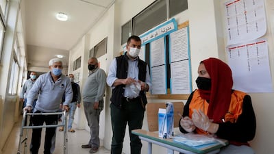 People wait to cast their votes during parliamentary elections in Amman. Reuters