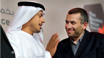 Rabee Jaber, right, is presented the IPAF award by Sheikh Sultan bin Tahnoon Al Nahyan.