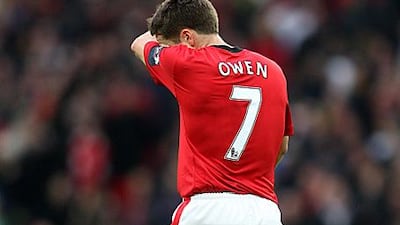 Michael Owen trudges off following the injury he sustained in the Carling Cup final.