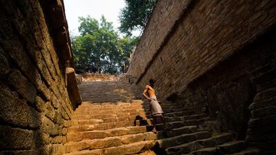 A local painter, Sheikh Nazir Udin descends the steps of the Gandhak Ki Baoli in Mehrauli to bathe.