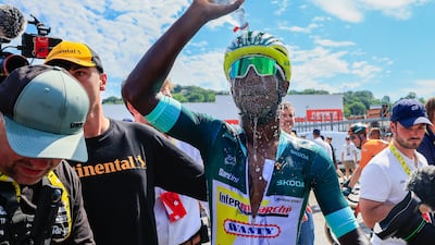 Eritrea's Biniam Girmay cools off after winning Stage 12. AP