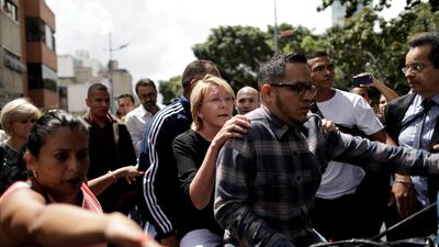 Venezuela's chief prosecutor Luisa Ortega is seen on a motorbike after a flash visit to the Public Prosecutor's office in Caracas, Venezuela on August 5, 2017. Ueslei Marcelino / Reuters