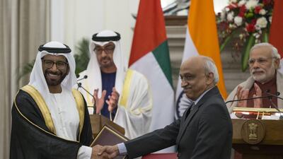 Sheikh Mohammed bin Zayed, Crown Prince of Abu Dhabi and Deputy Supreme Commander of the Armed Forces and Narendra Modi Prime Minister of India witness the exchange of a memorandum of understanding between India and the UAE pertaining to the exploration of space. Seen exchanging on behalf of the UAE is Dr Khalifa Al Romaithi, Chairman of the UAE Space Agency. Ryan Carter / Crown Prince Court - Abu Dhabi