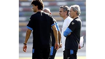 Jose Mourinho, second right, ran the rule over his players at Zayed Sports City yesterday.