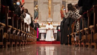 Pope Francis prays with migrants at the Roman Catholic church of the Holy Cross near the United Nations buffer zone in the Cypriot city of Nicosia. AFP