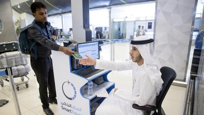 The smart travel programme will eventually allow a passenger to check-in and move through immigration and security without human contact, interacting only with technology. Christopher Pike / The National