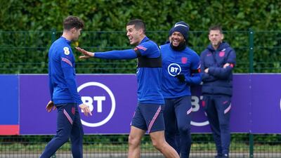 England's John Stones, left, and Conor Coady during training at Hotspur Way Training Ground. PA