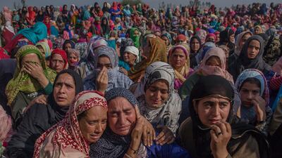 Kashmiri women comfort a wailing relative of Kashmiri rebel Irfan Ahmed, who was killed in a gun battle with Indian government forces, during his funeral in Haf-Shirmal village on October 10, 2017. Dar Yasin / The Associated Press