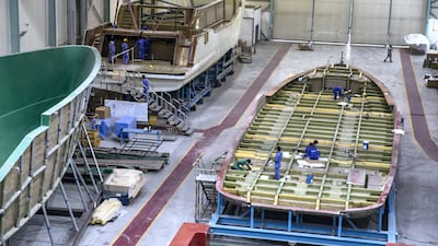 The broad base of one of the larger yachts takes shape. Composite vessels have a shallow draft, making them ideal for beach access.