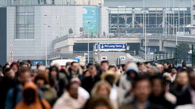 Passengers evacuate Zaventem Airport in Brussels on Tuesday. Dirk Waem / EPA