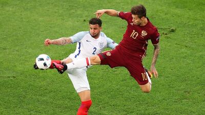 Fedor Smolov (R) of Russia in action against Kyle Walker (L) of England during the Uefa Euro 2016 group B preliminary round match between England and Russia at Stade Velodrome in Marseille, France, 11 June 2016. Ali Haider / EPA