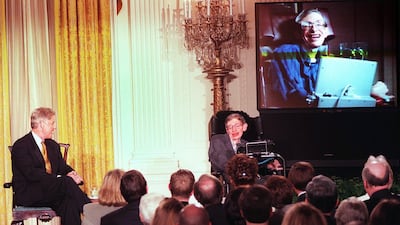 US President Bill Clinton and British professor Stephen Hawking watch a scene from "Star Trek the Next Generation" during a "Millennium Evening" at the White House in Washington, DC on March 6, 1998. Tim Sloan / AFP