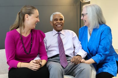 From left, Tessa, Gary and Janet Roberts believe more women will be inspired to cast their ballot for Kamala Harris. Victor Besa / The National